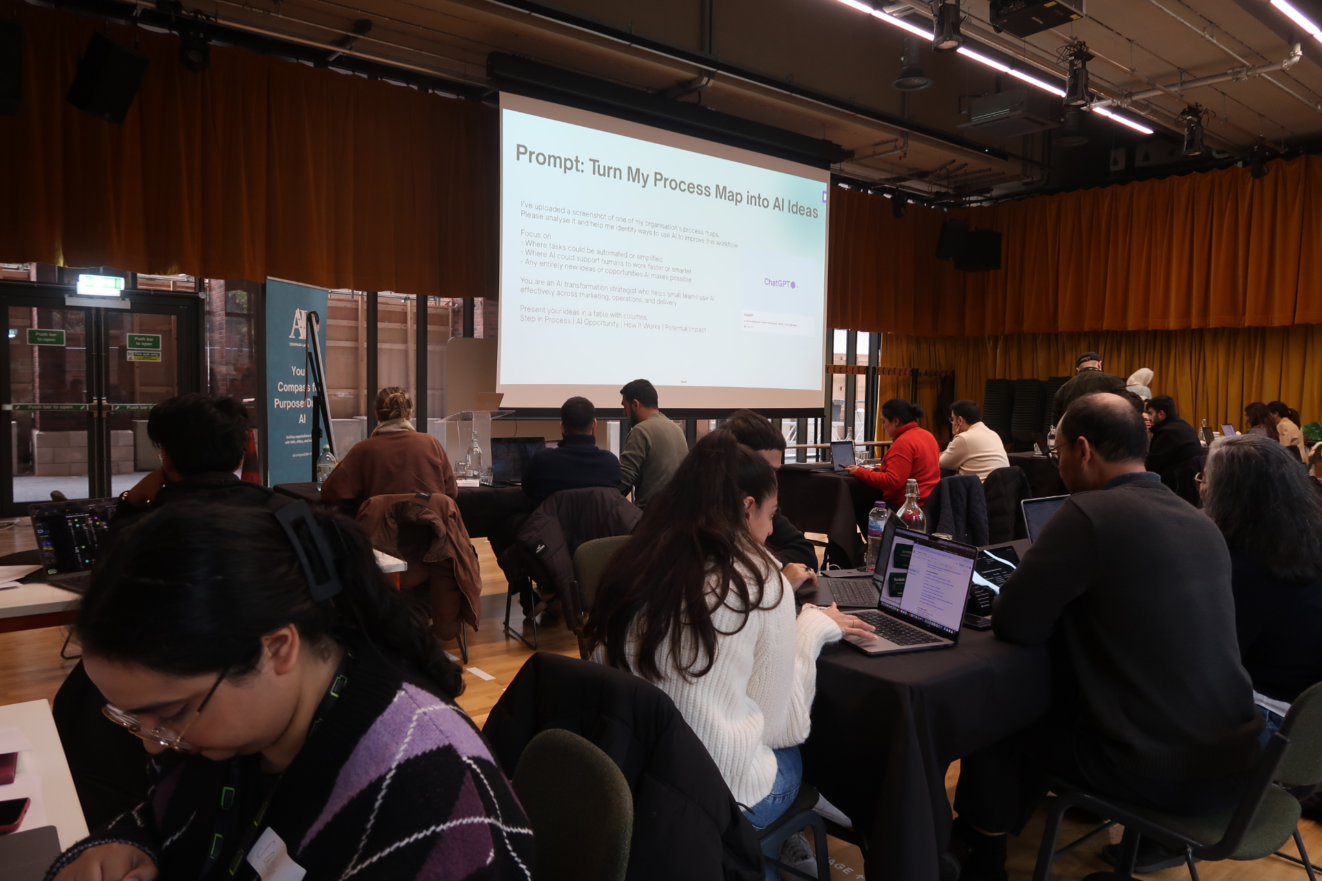 Educators working on laptops during hands-on AI workshop